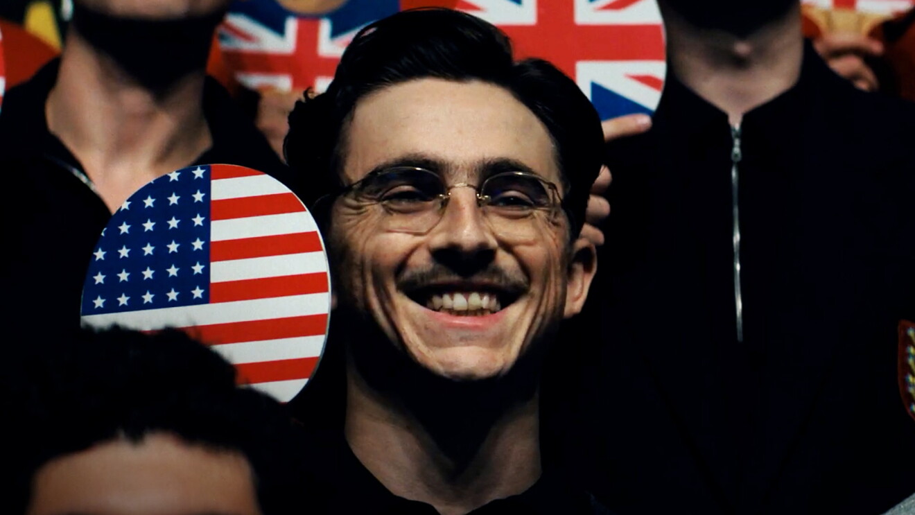 Man with glasses smiling