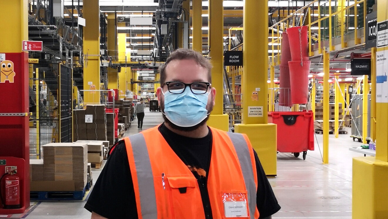 Glenn Johnson, Stores coordinator at Amazon fulfilment centre in Warrington, pictured in a high visibility vest and face mask