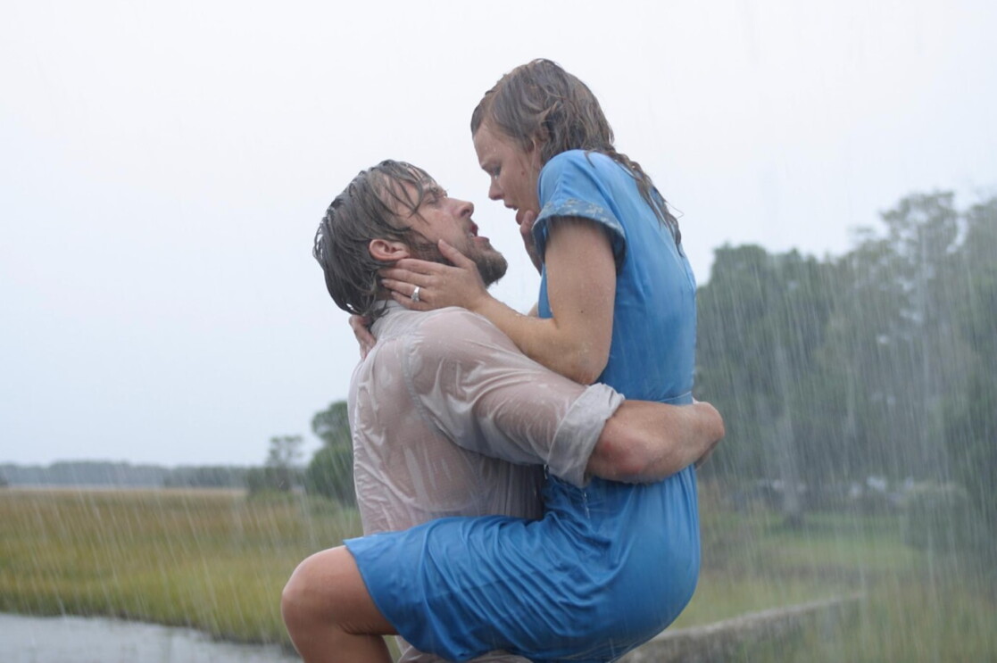 A man and woman hold each other in the rain