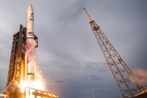 A ULA rocket takes launch into a night sky.