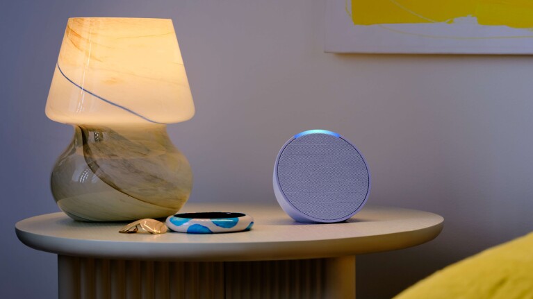 An image of an Echo pop sitting on a nightstand.