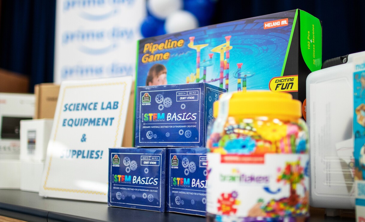 Amazon employees surprise nonprofits and schools with donations of various items.