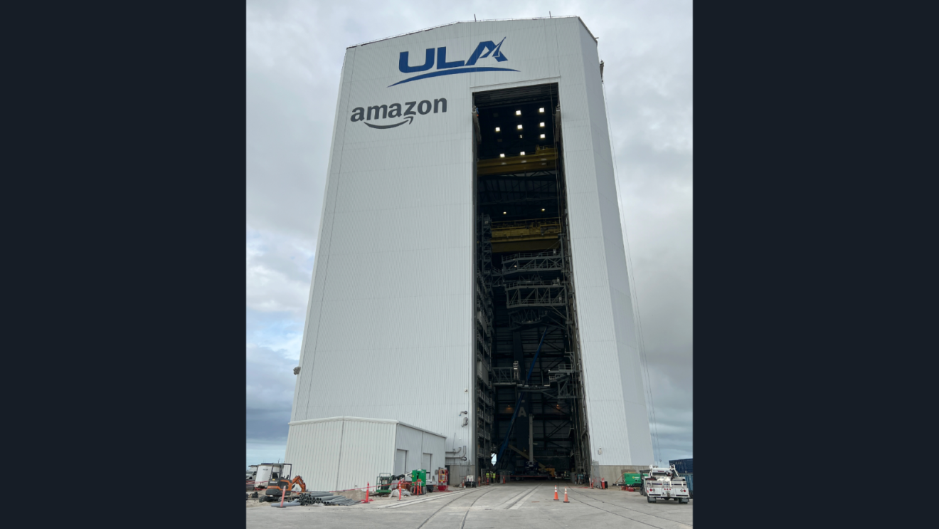 ULA and Amazon logos on tall white rocket assembly building