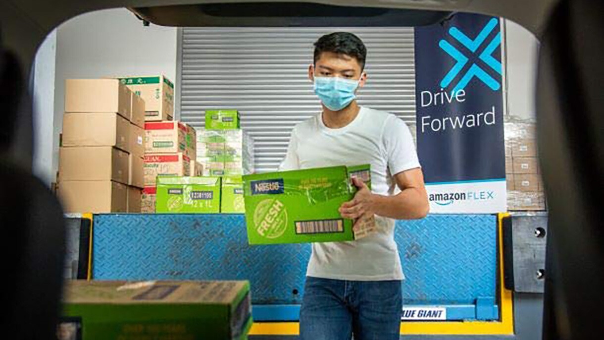 Amazon employees work together to gather and provide nonprofit donations for people in need.