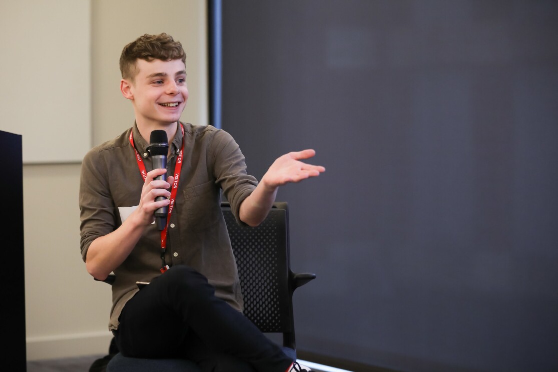 A shot of Jamie Brown, an engineer at the Financial Times, chairing a panel at Glamazon's LGBT leaders in STEM event.