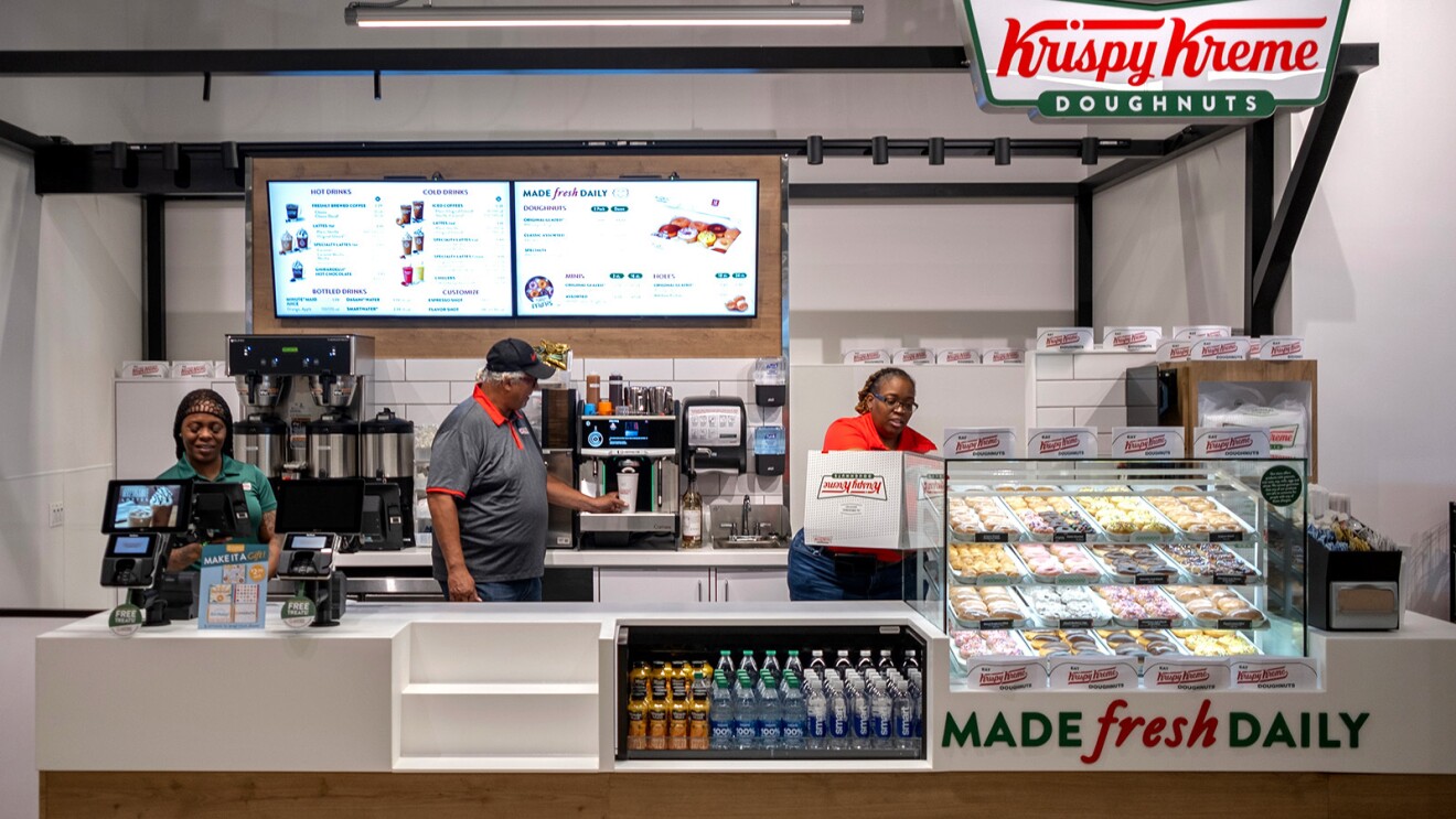 A photo of a Krispy Kreme donut kiosk inside an Amazon Fresh store.