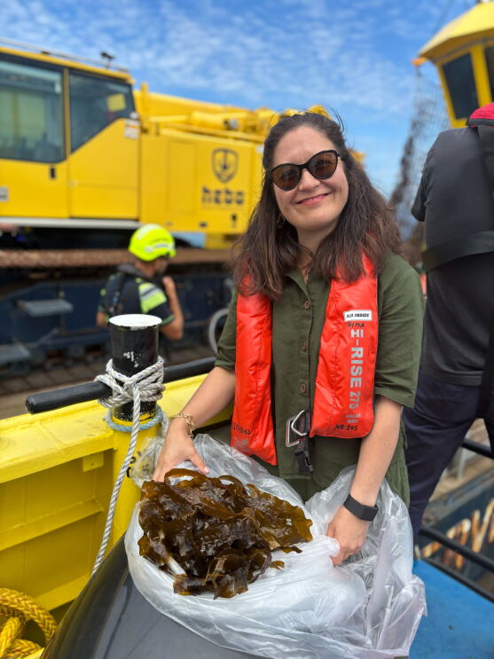Jasmine Hyman, global lead of Amazon’s Right Now Climate Fund with some of the first sugar kelp to be harvested   