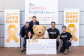 Amazon employees present a $6,048 check to The Children's Hosital at Westmead.