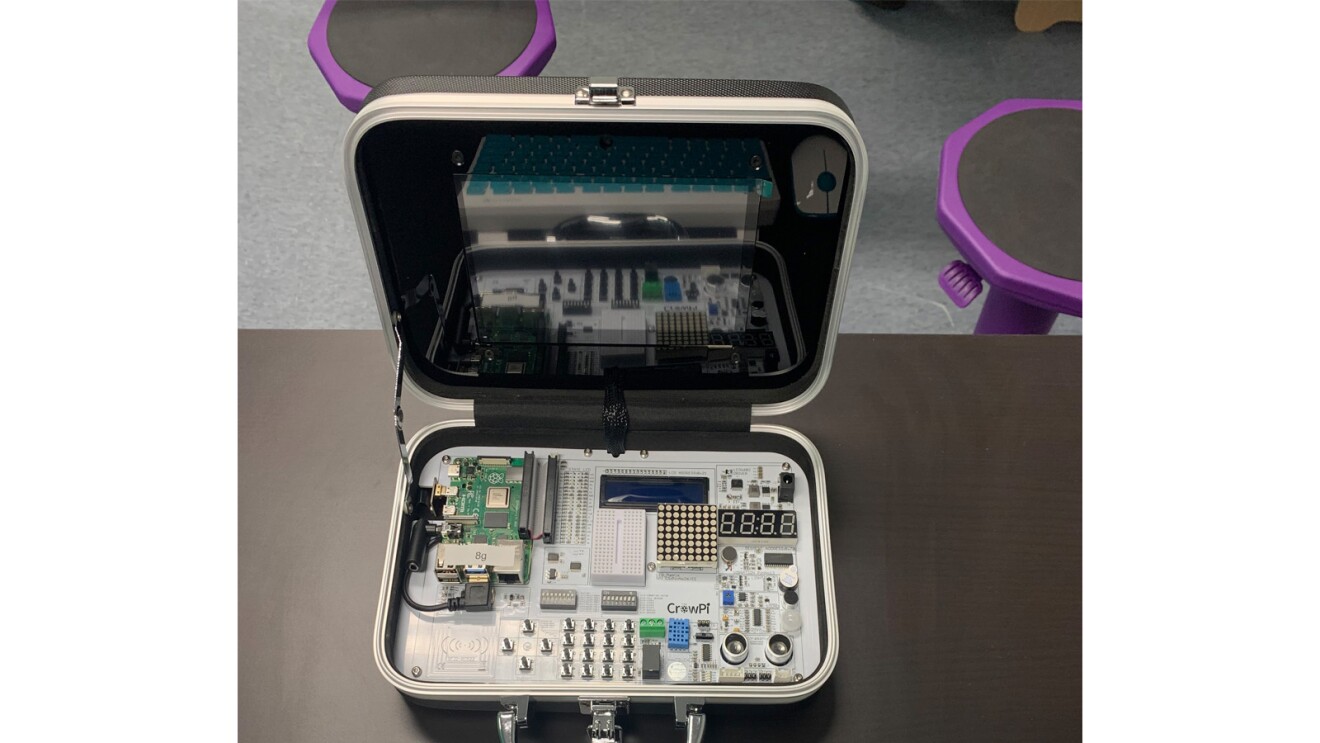 An image of a case with electronic hardware for students to work on.