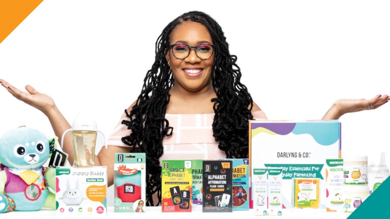 A photo of Darlyng & Co. CEO Detara Williams standing behind several Darlyng & Co. products.