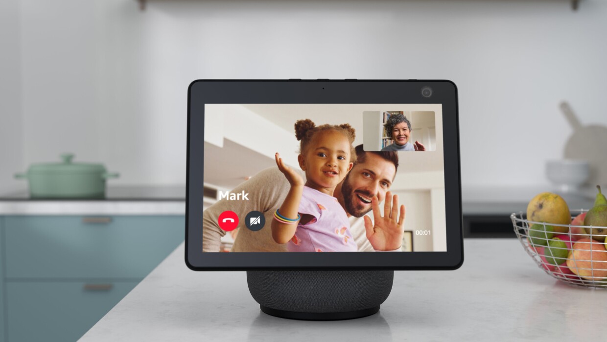 The Amazon Echo Show 10 on a kitchen counter top showing a video call.