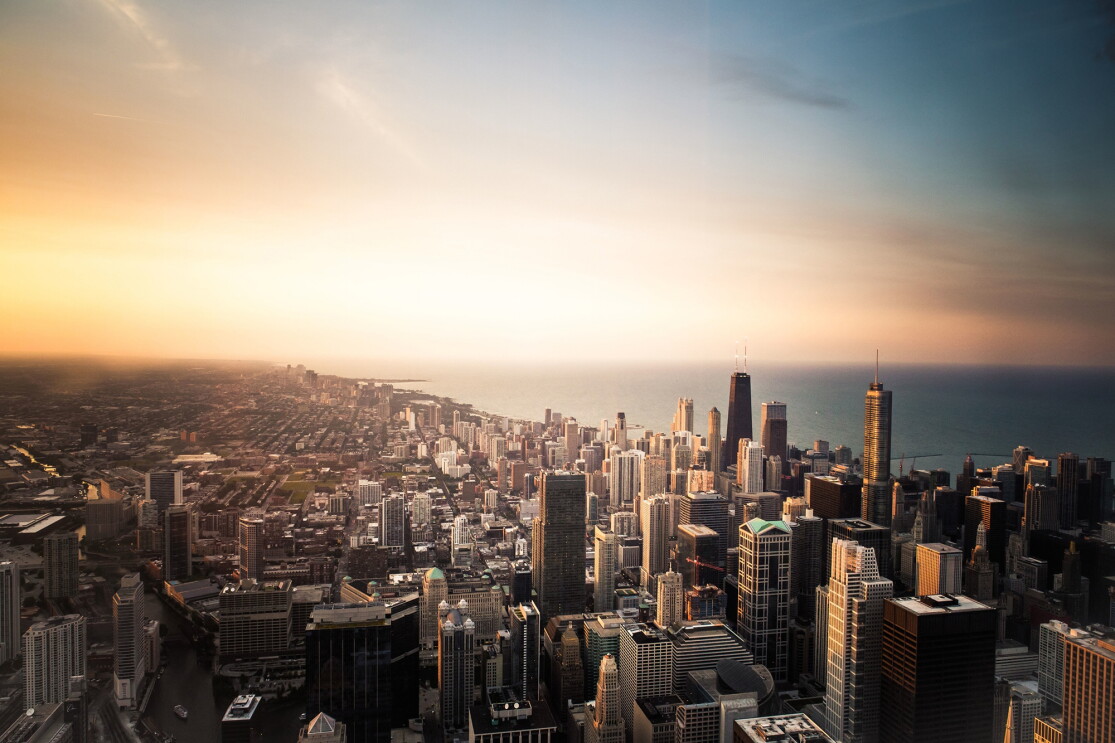 The Chicago Loop skyline with Lake Michigan and sunset background