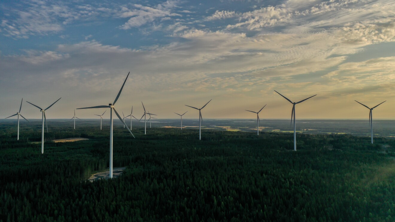 Image of wind warm propellers over the horizon at sunrise.