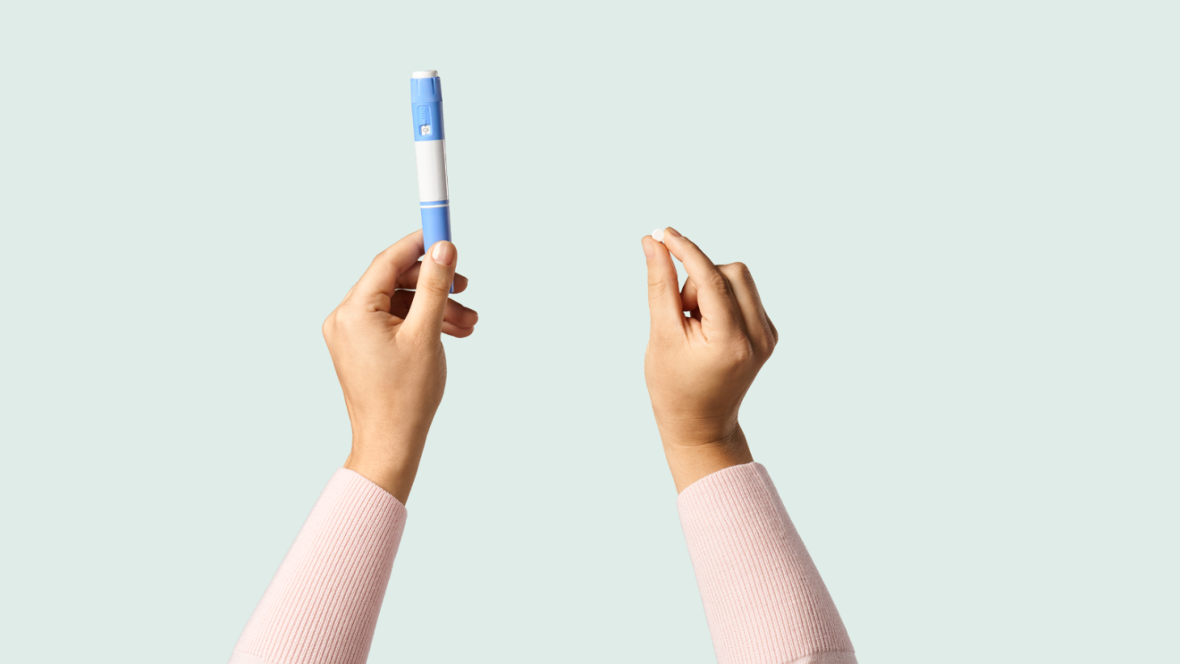 Person in pink sweater holding GLP-1 medication options