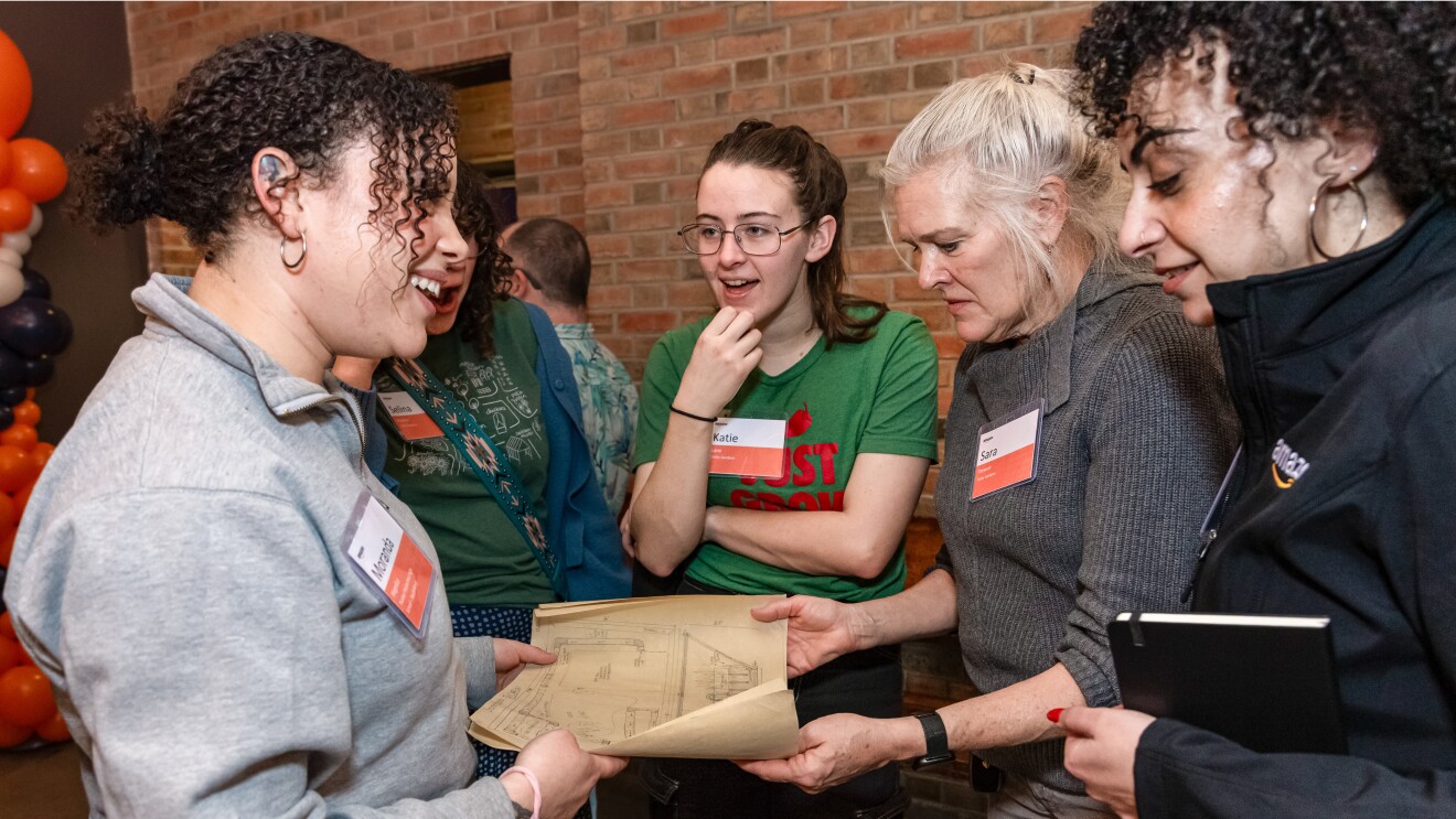 women discussing plans, engaged in conversatoin