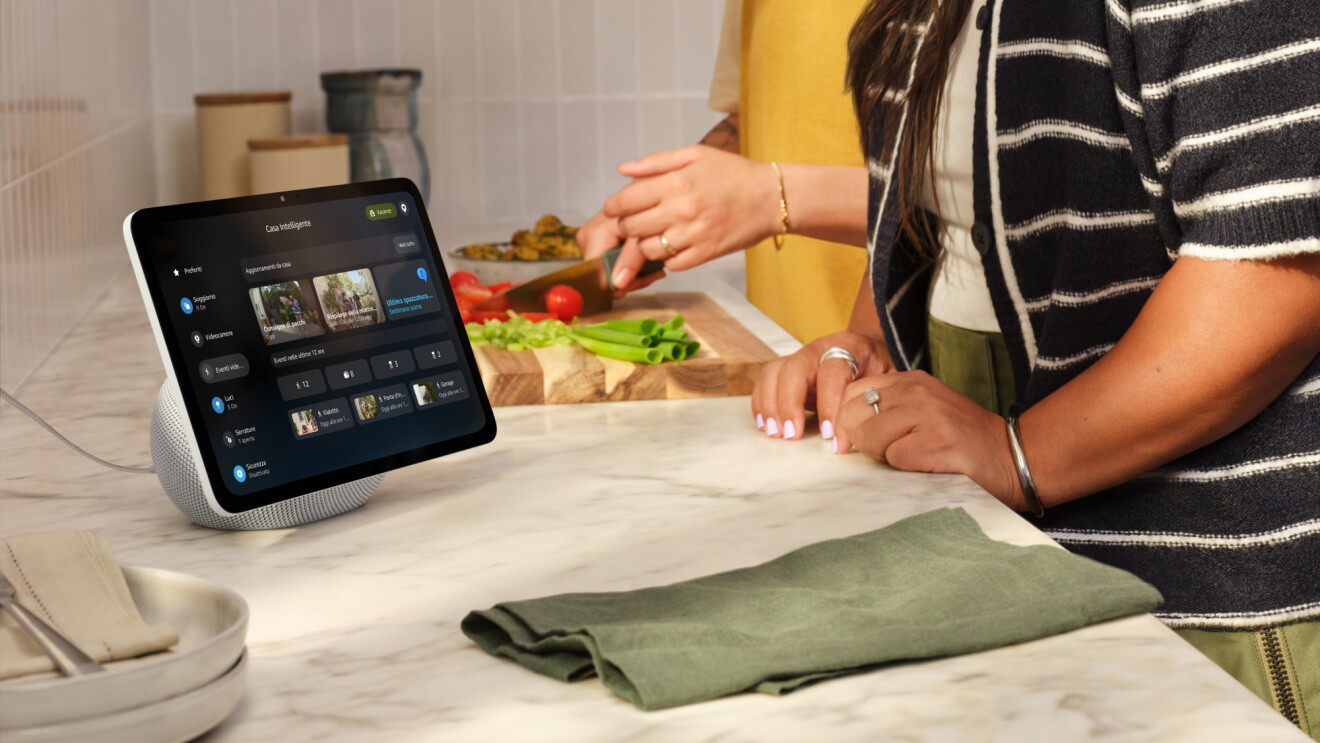 Two women preparing food in the kitchen with Alexa on their Amazon Echo Show on the counter