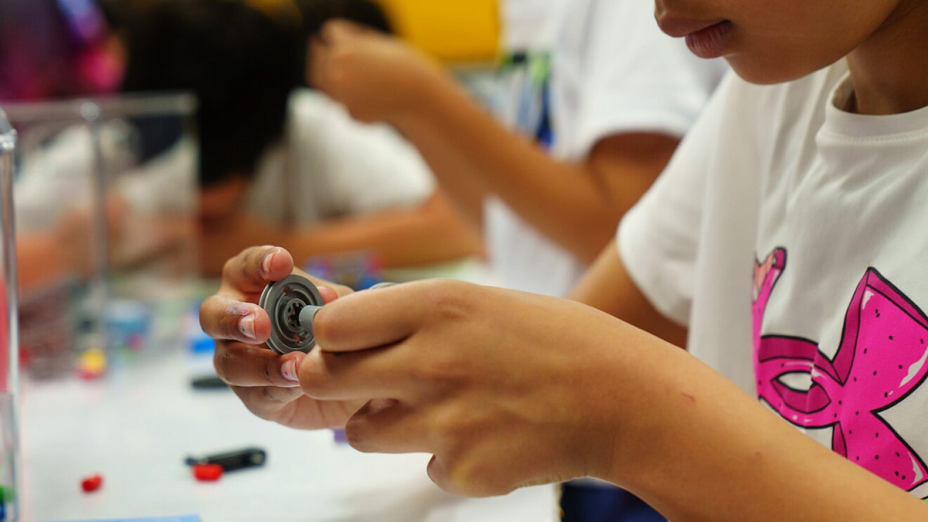 A photo of a student working on mechanics in an AWS Think Big Space at River Oaks Elementary School.