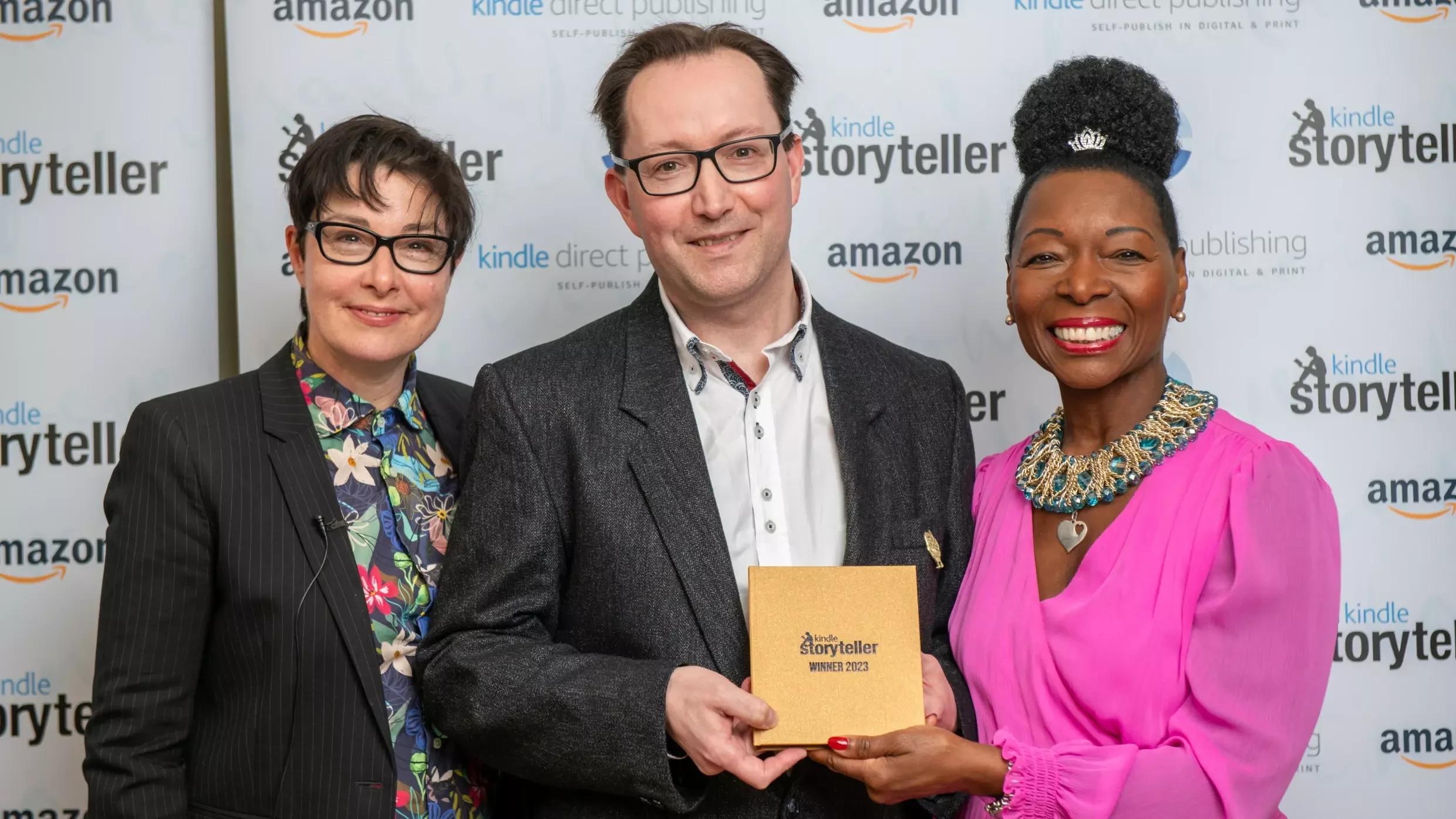 GJ Ogden is awarded the Kindle Storyteller Award by prize judges Sue Perkins and Baroness Floella Benjamin