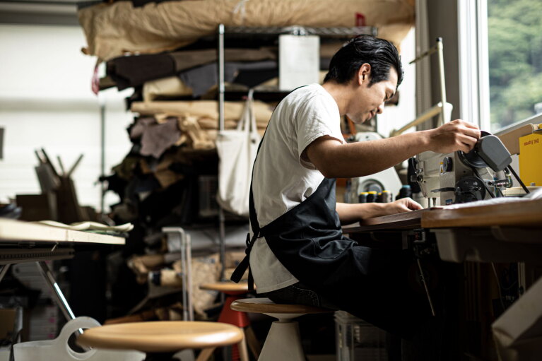 A craftsman works at his station.