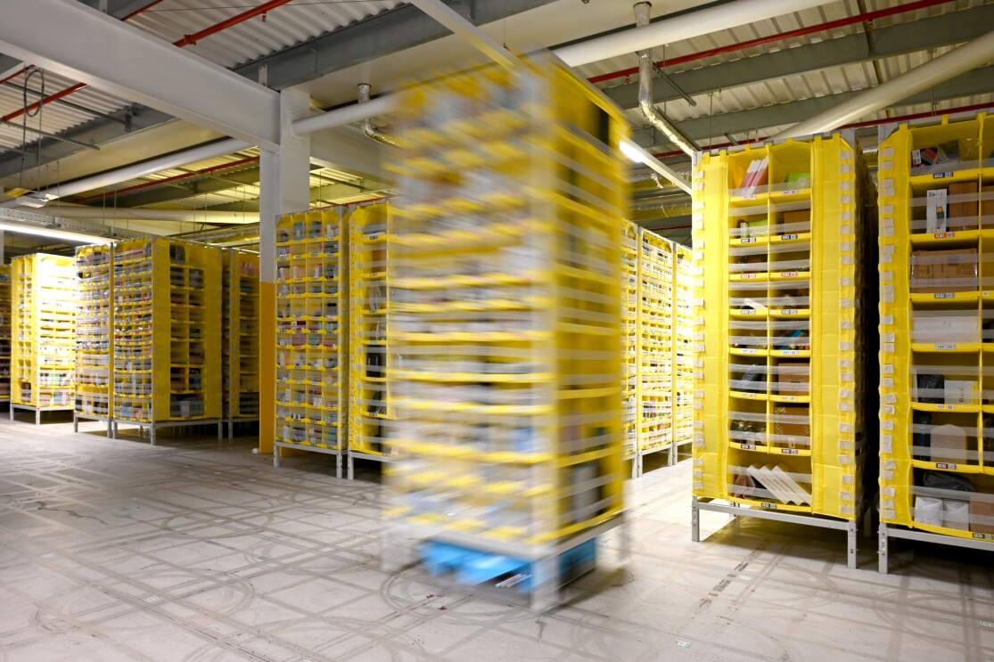 Automated storage system with blurred moving rack in an Amazon Fulfilment Centre