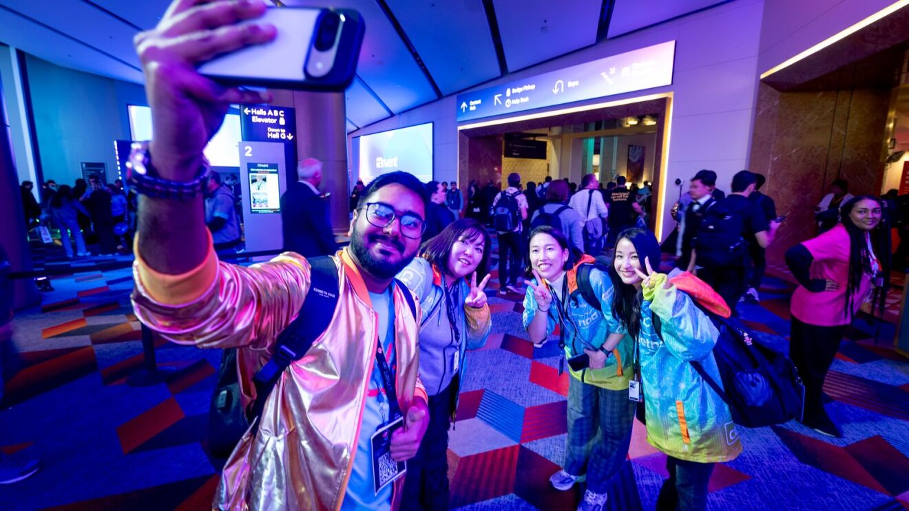 AWS re:Invent attendees taking a photo.