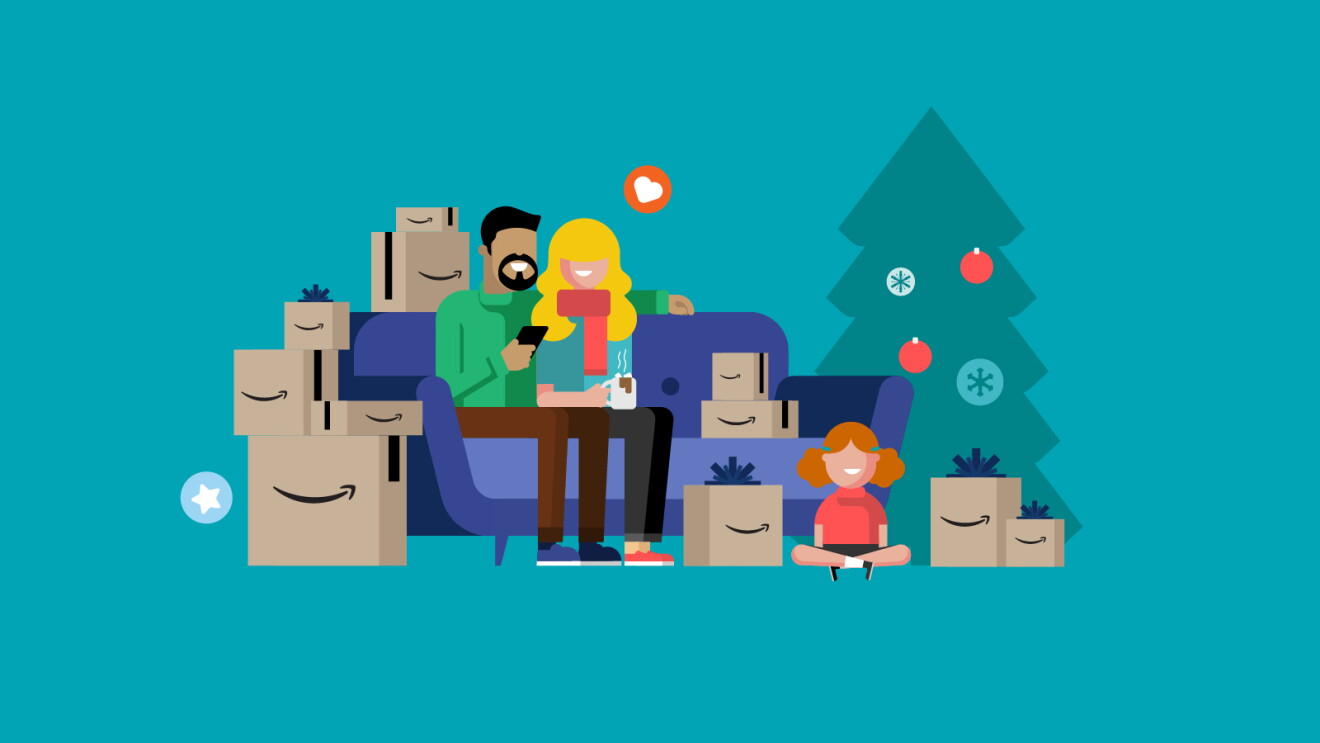 Family relaxing on couch surrounded by Amazon packages and Christmas tree