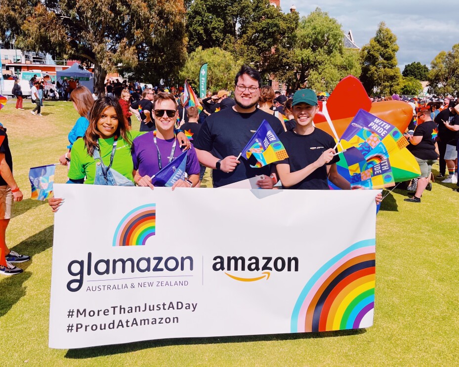 Amazon employees holding Glamazon banner at Midsumma