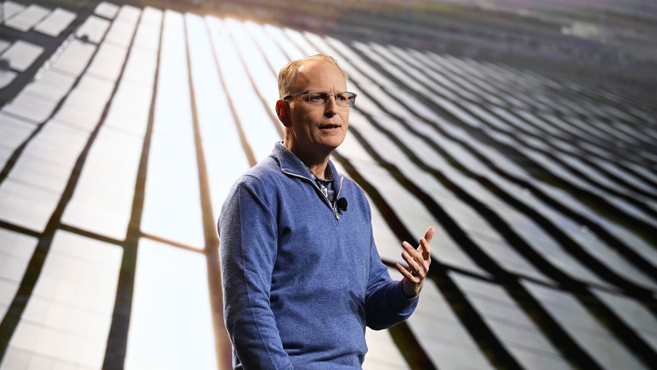 An image of Dave Limp speaking during a presentation.