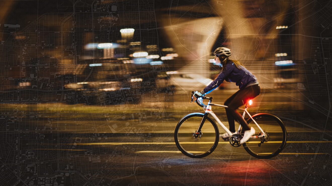 female cyclist pictured on a city map background 