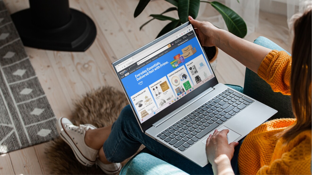Person browsing Amazon's Everyday Essentials page on laptop
