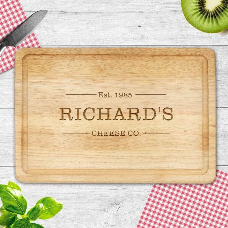 A personalised chopping board that says 'Richard's Cheese Co.'
