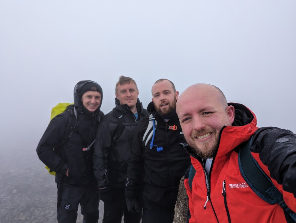 Dan Marsden and his friends on top of a moutain they climbed for charity