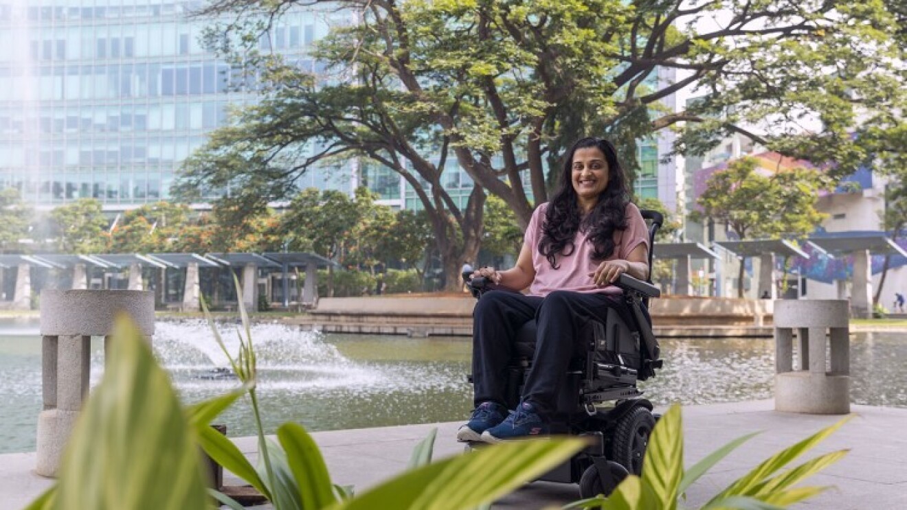 Mrunmaiy Abroal smiles for a photo in front of the Amazon building in Bangalore, India.