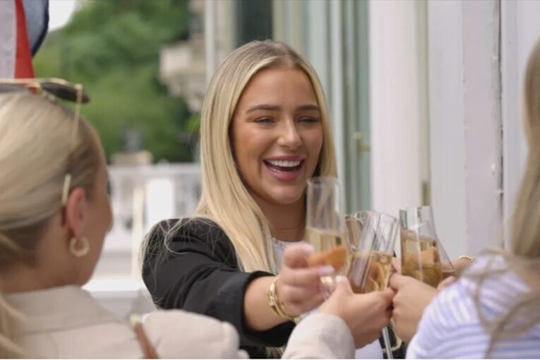 Three blonde women having drinks