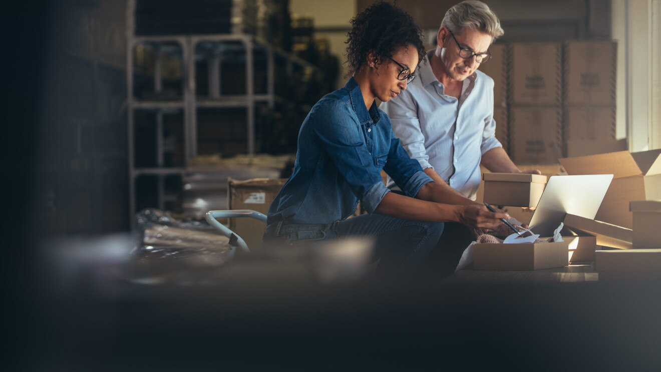Online shop business partners working in small office together - illustration of SMEs selling on Amazon