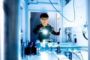top down view of AWS liquid cooling system with technician hand/screwdriver in frame, diagonal view