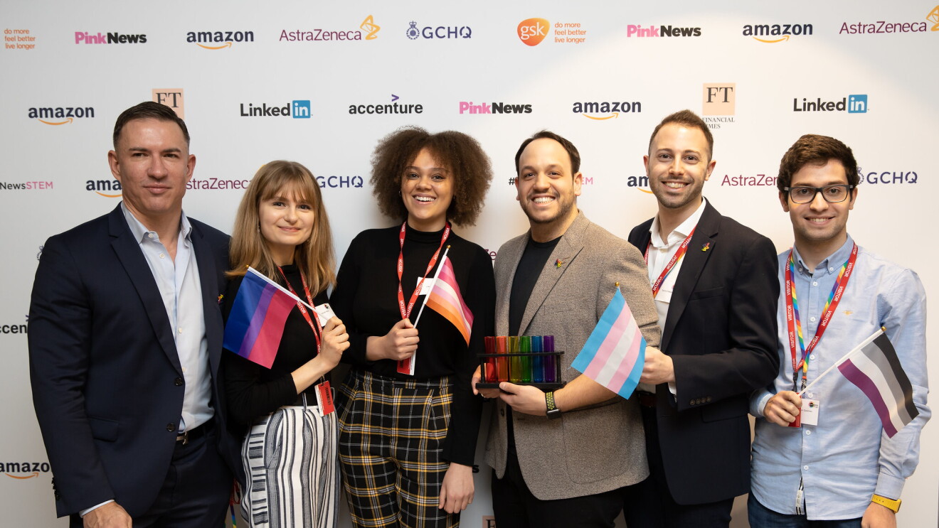 STEM leaders from Amazon at the 2020 British LGBT+ Awards, they are holding flags which are representative of the various LGBT+ communities. 
