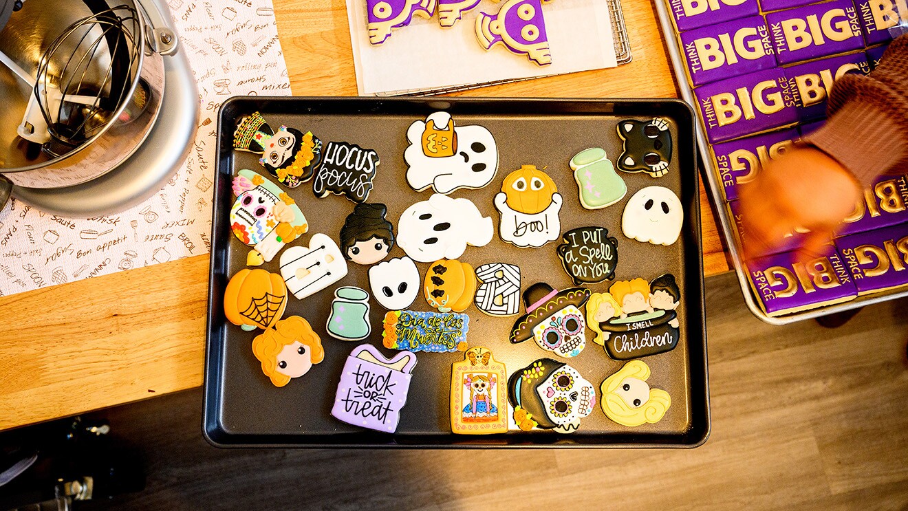 A photo of intricately decorated Halloween-themed cookies.