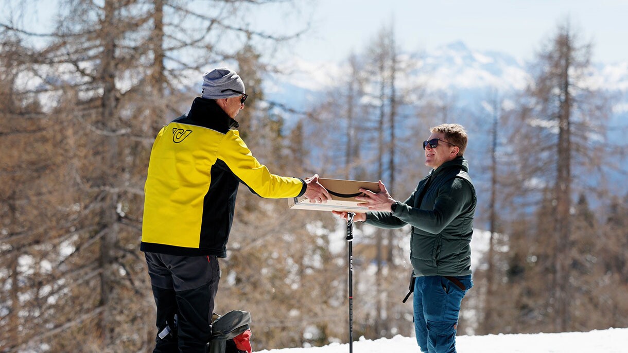 Helmut Edelmaier delivers an Amazon package to a customer on the mountain.