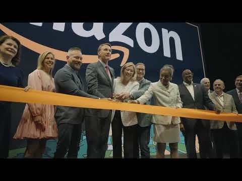 An image of local officials touring Amazon's second headquarters on its opening day