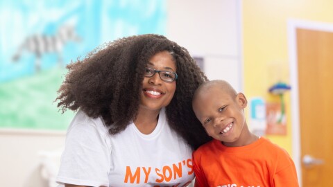 An image of a mother and son smiling for a photo at St. Jude's Children's Hospital.