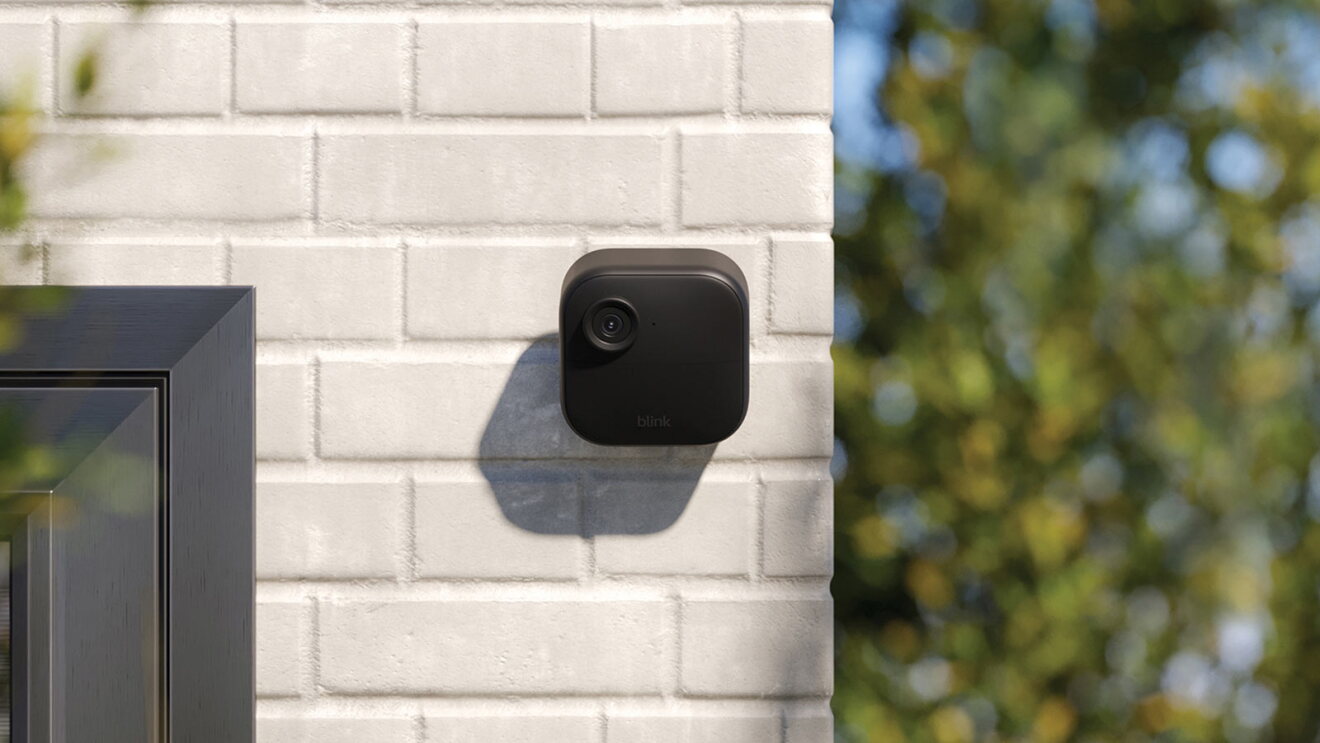 Blink outdoor security camera installed on exterior house wall