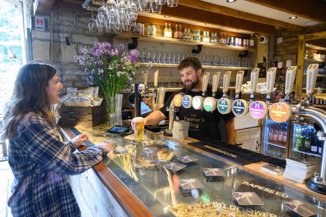 Ordering a drink at the bar at The Farmer's Dog in Burford, Jeremy Clarkson's proper British pub from Clarkson's Farm season 4