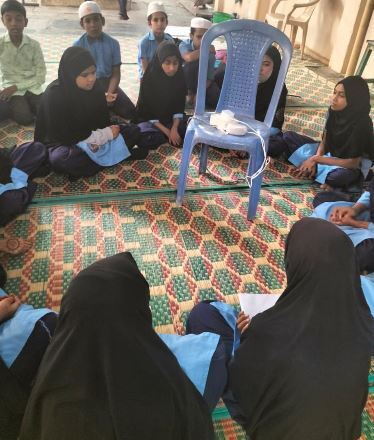 Students interact with Alexa at GUHPS Venkateshapura, a government Urdu school in Bengaluru. 