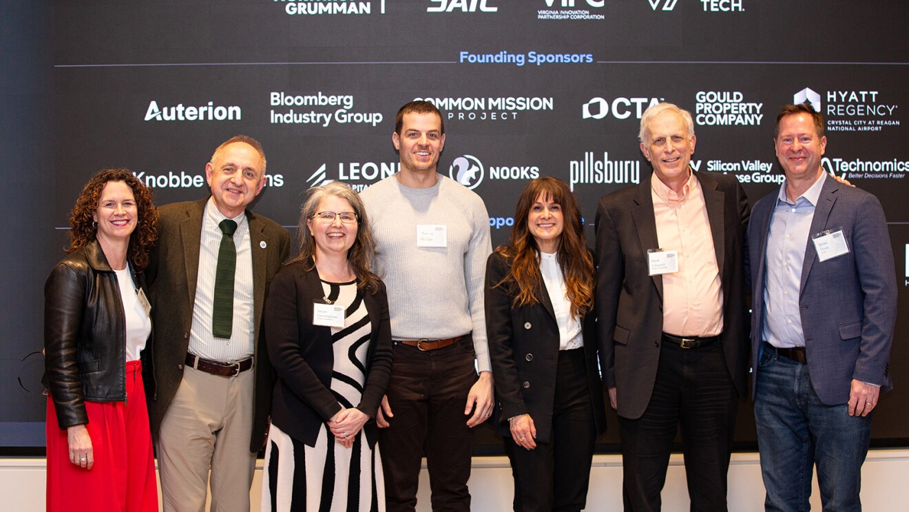 Group photo of founding sponsors at corporate event