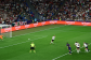 Womens football photo showing a players on the pitch with orange, Amazon branding at the edge of the pitch