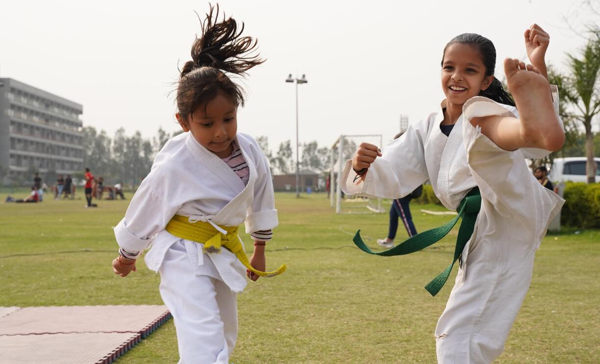 Two girls practicing Martial Arts