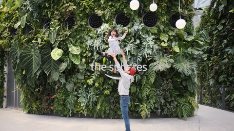 Jun Hao and his daughter in front of the Spheres in Seattle