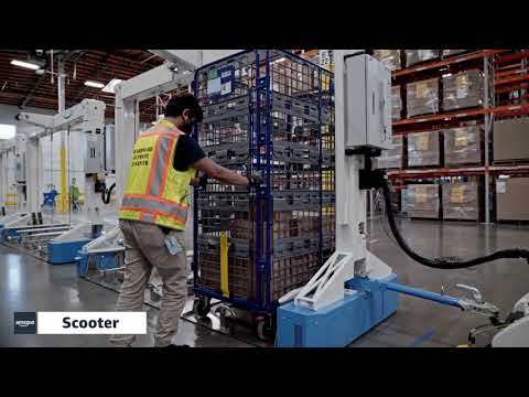 "Scooter" pulls carts through an Amazon fulfillment center
