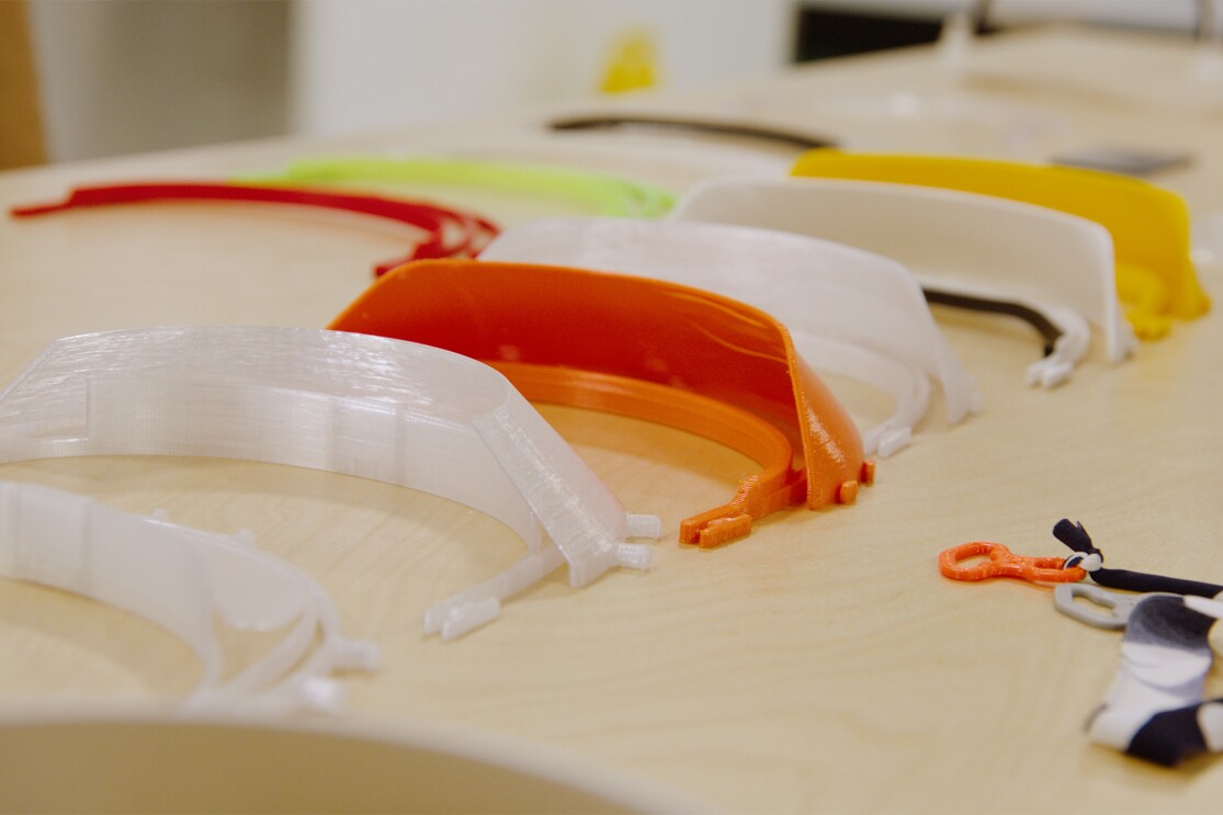 Volunteers work together to use technology to make PPE for medical professionals during the COVID-19 pandemic